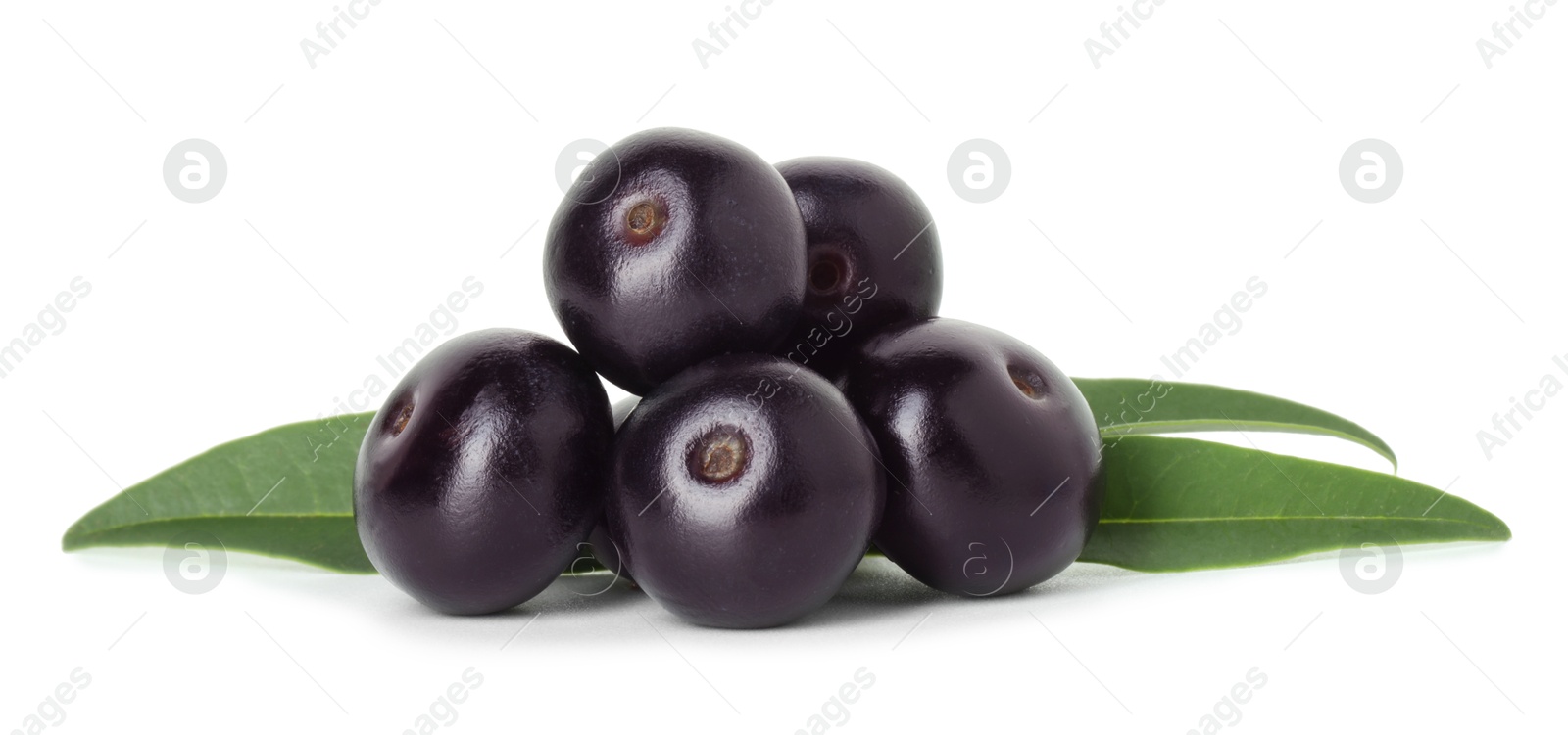 Photo of Fresh ripe acai berries and green leaves isolated on white