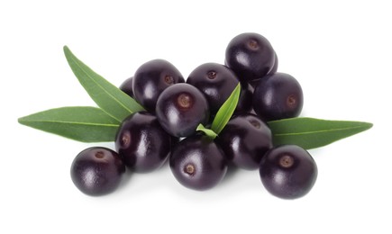 Fresh ripe acai berries and green leaves isolated on white