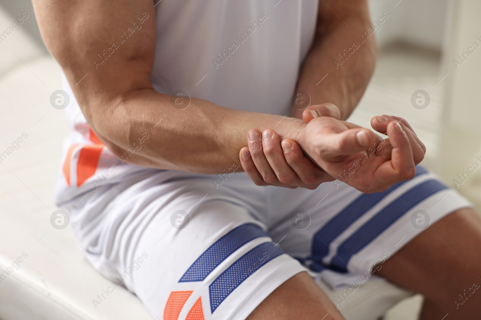 Photo of Sportsman with injured hand in hospital, closeup