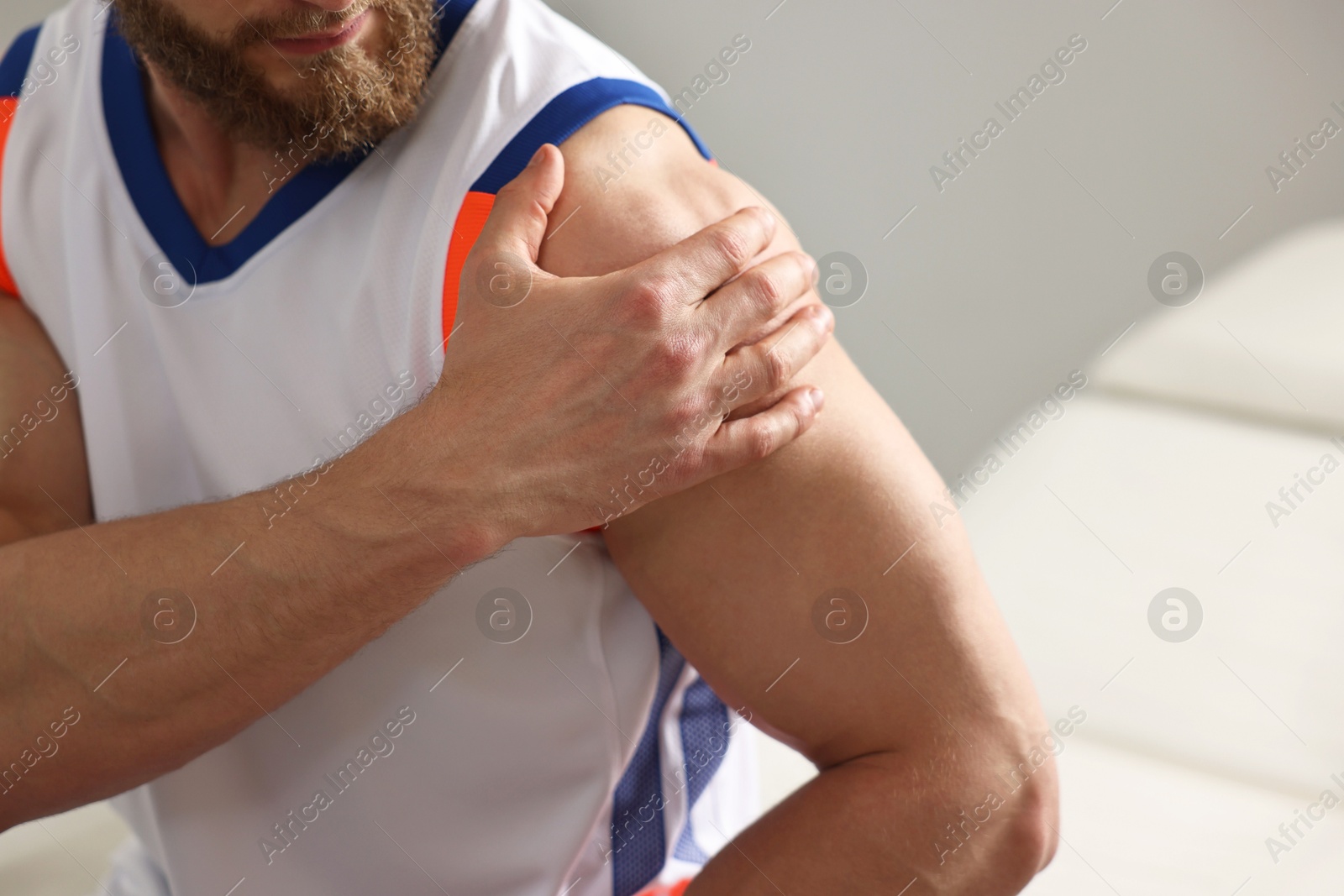 Photo of Sportsman with injured shoulder in hospital, closeup