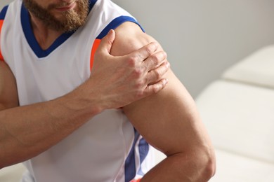 Photo of Sportsman with injured shoulder in hospital, closeup