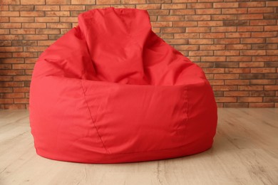 Red bean bag chair on floor in room