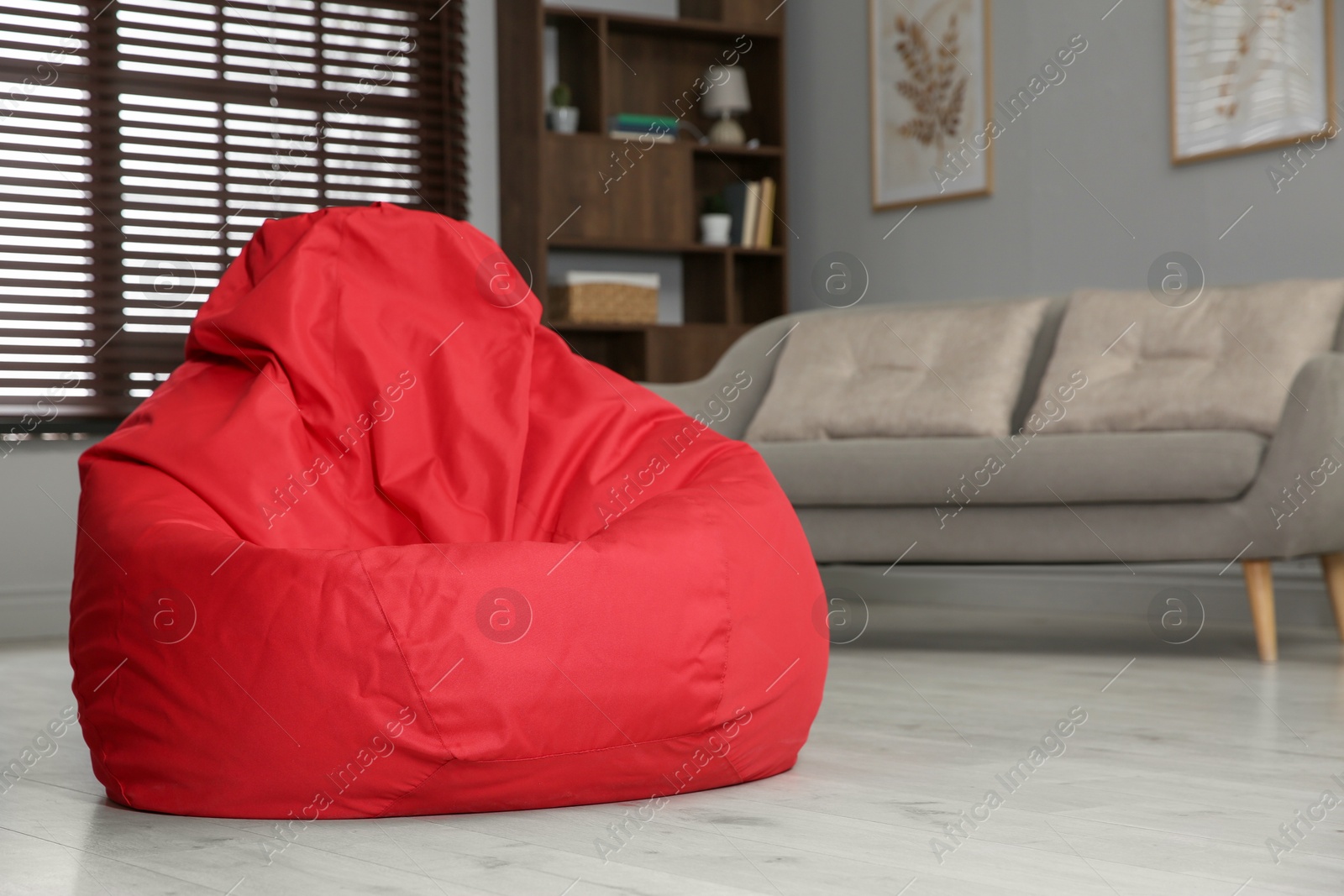 Photo of Red bean bag chair on floor in room