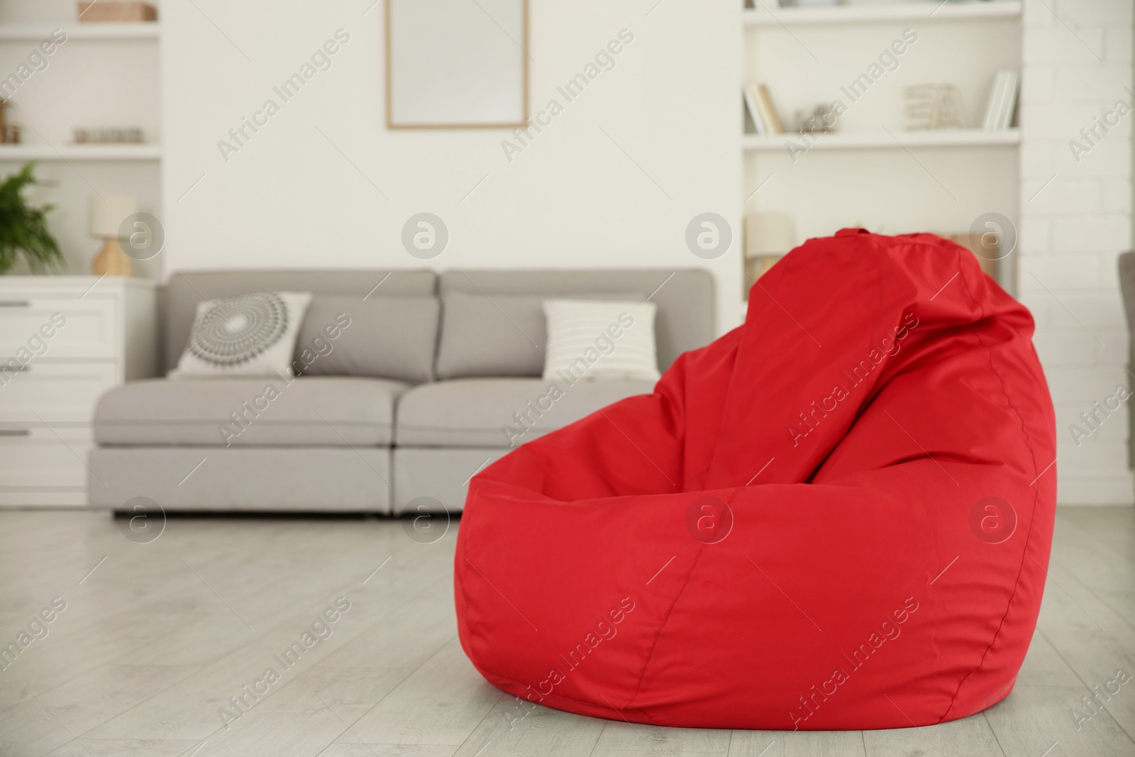 Photo of Red bean bag chair on floor in room