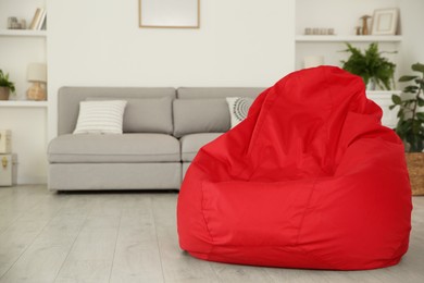 Photo of Red bean bag chair on floor in room
