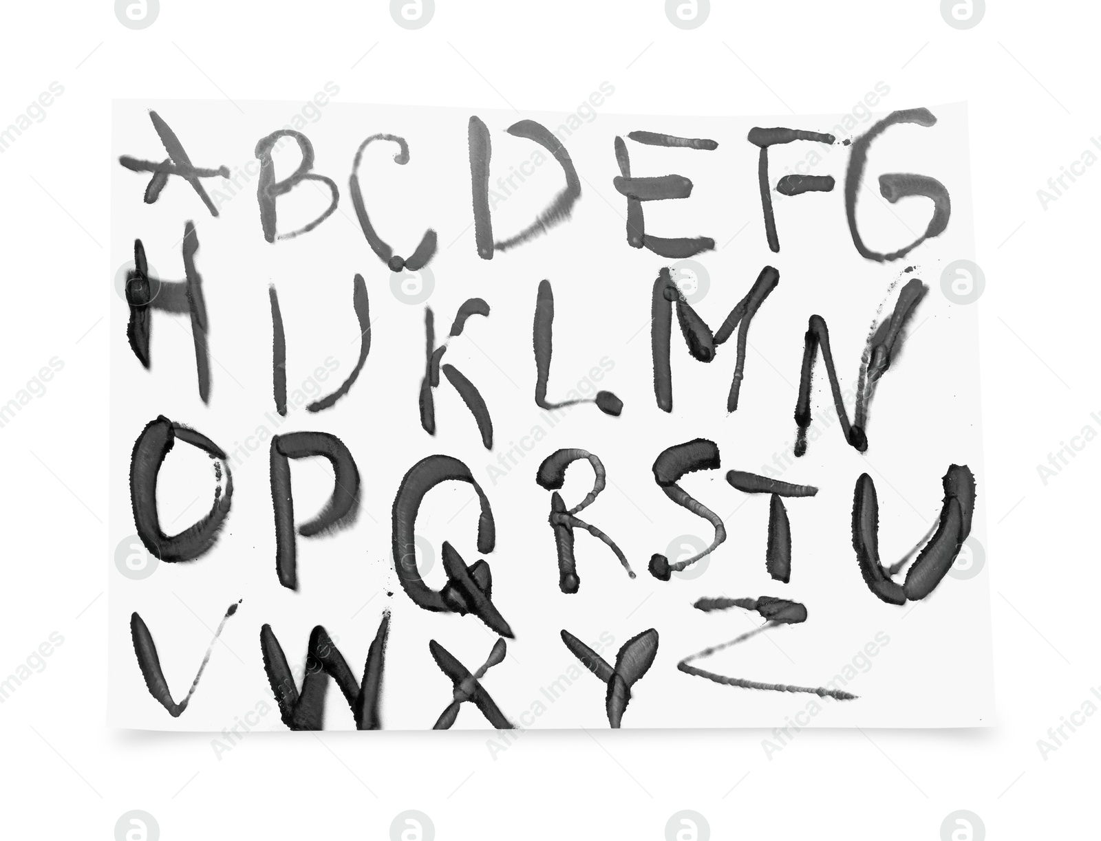 Photo of Alphabet written by grey spray paint isolated on white, top view