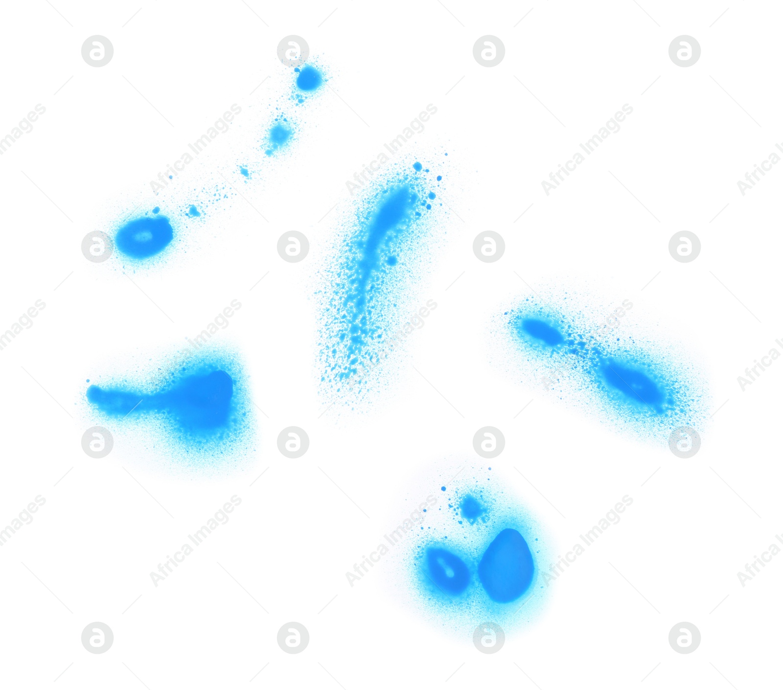 Photo of Abstract spots drawn by blue spray paint isolated on white, top view