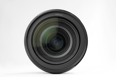 Camera lens on white background. Photographer's equipment