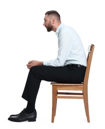 Man with poor posture sitting on chair against white background