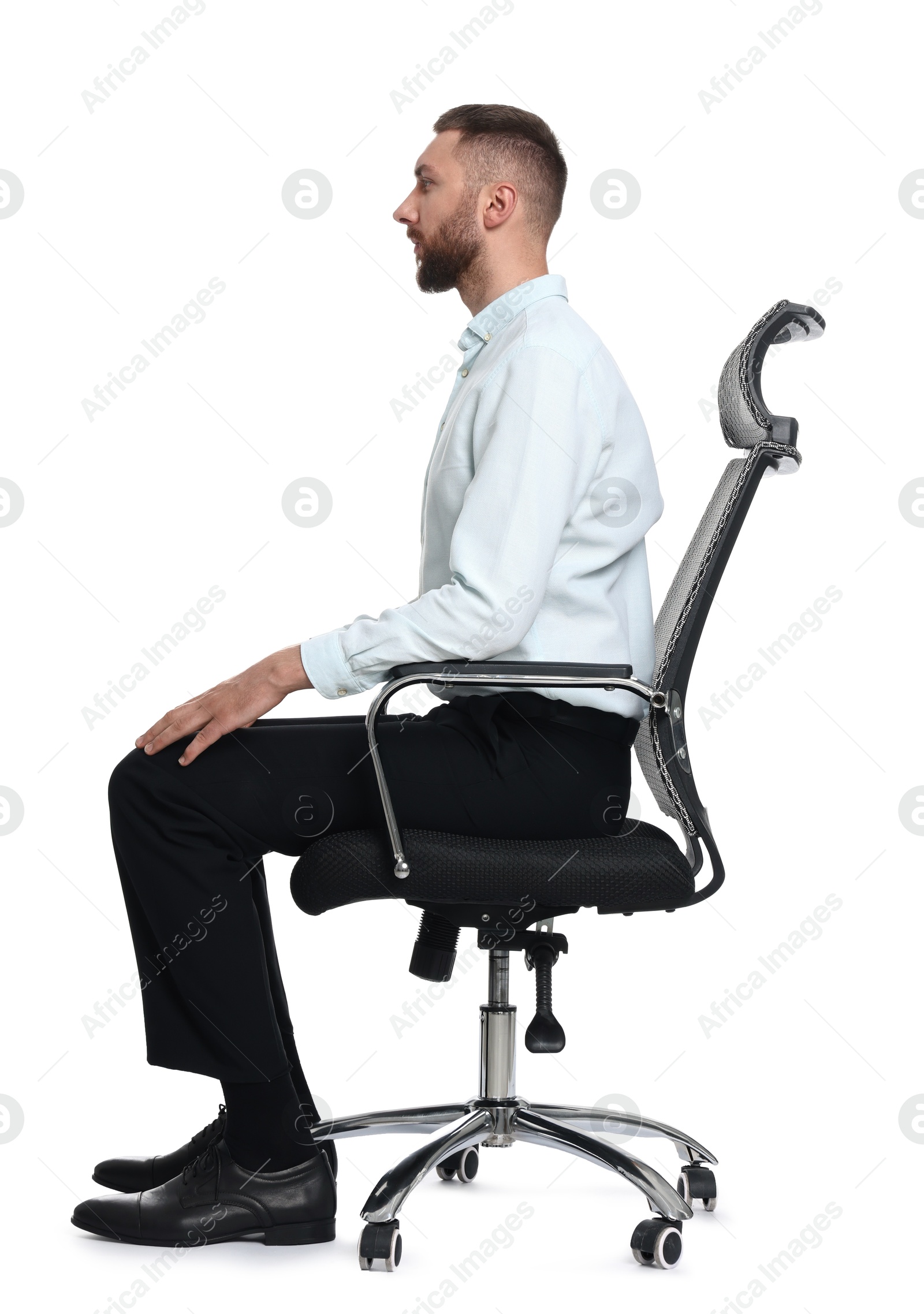 Photo of Man with good posture sitting on chair against white background