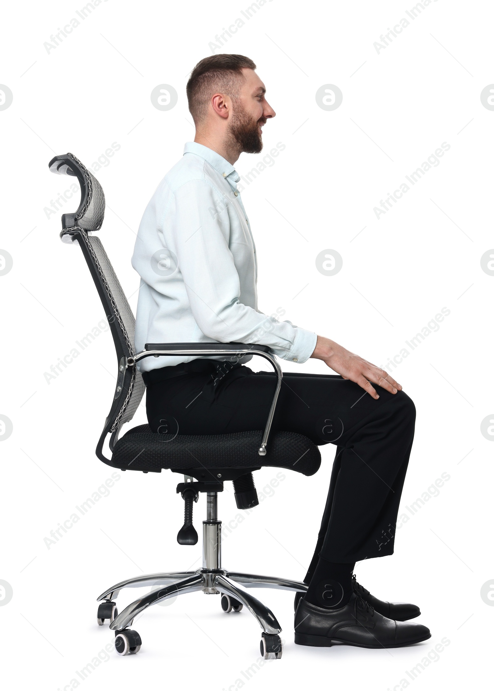 Photo of Man with good posture sitting on chair against white background