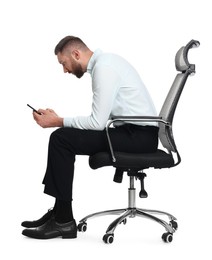 Man with poor posture sitting on chair and using smartphone against white background