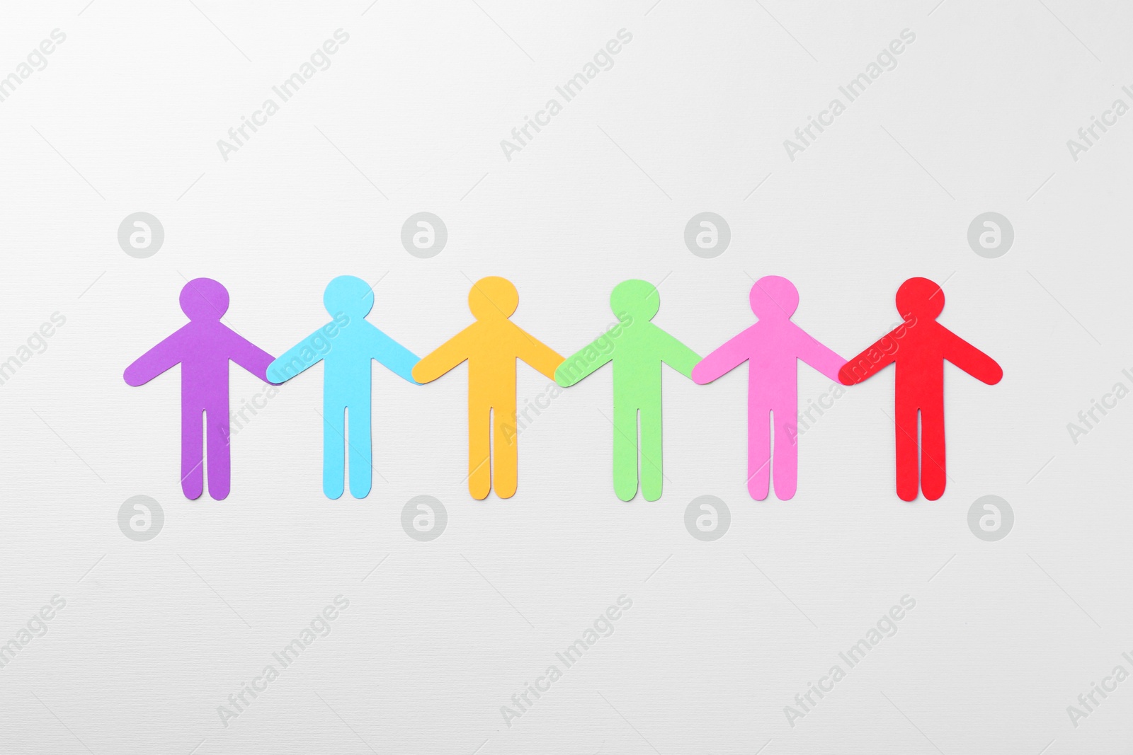 Photo of Equality concept. Paper human figures on light background, top view