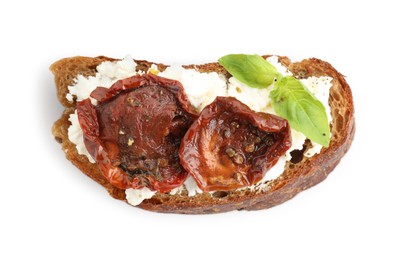 Photo of Delicious ricotta bruschetta with sun dried tomatoes and basil isolated on white, top view