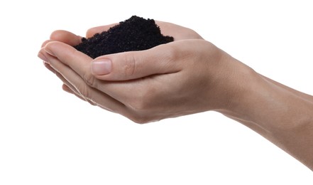 Woman holding pile of soil on white background, closeup