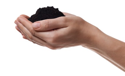 Woman holding pile of soil on white background, closeup