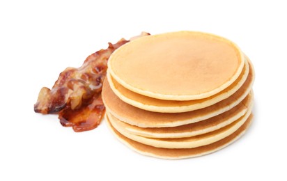 Photo of Delicious pancakes with fried bacon isolated on white