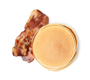 Delicious pancakes with fried bacon isolated on white, top view