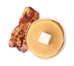 Delicious pancakes with butter and fried bacon isolated on white, top view