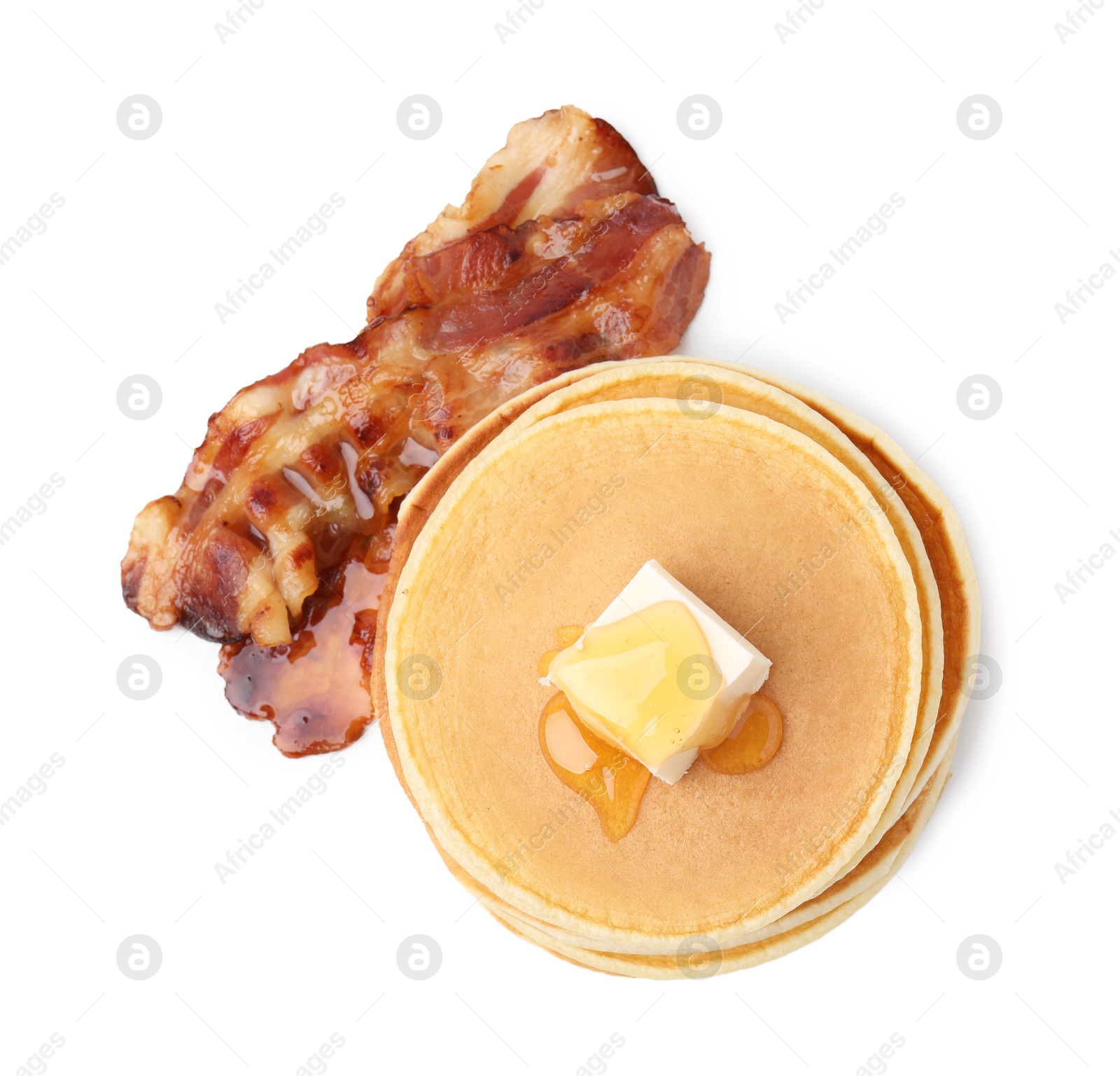 Photo of Delicious pancakes with butter and fried bacon isolated on white, top view