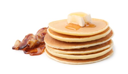 Delicious pancakes with butter and fried bacon isolated on white