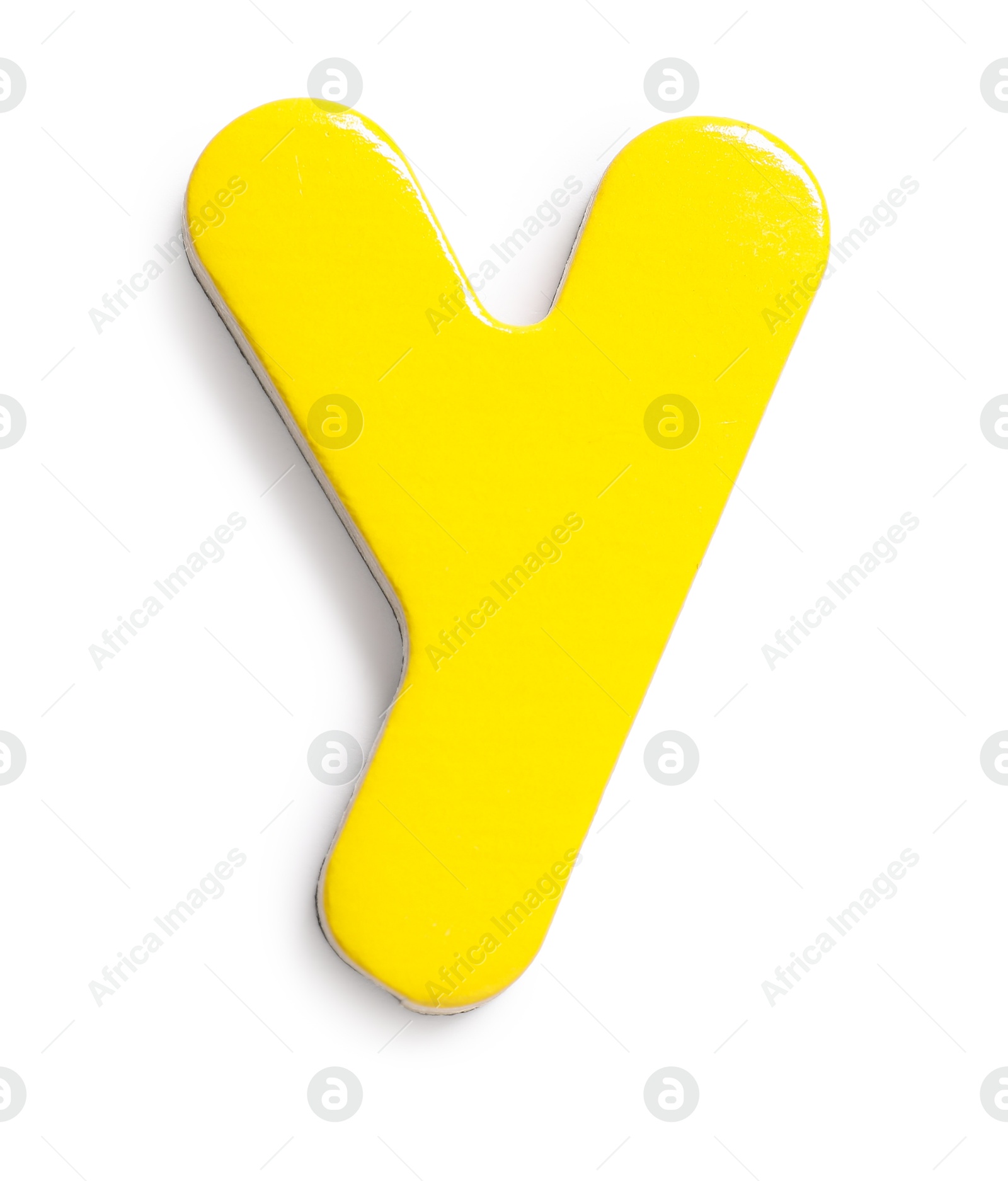 Photo of Yellow magnetic letter Y isolated on white, top view. Alphabet
