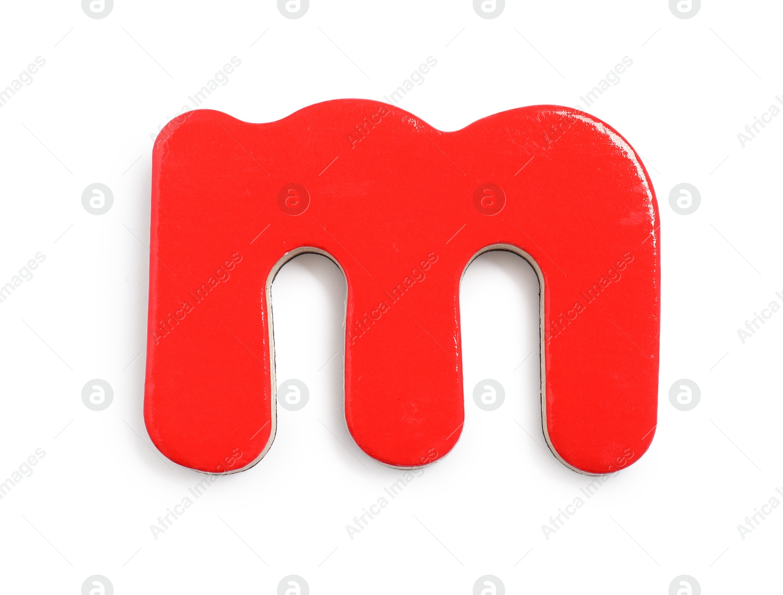 Photo of Red magnetic letter M isolated on white, top view. Alphabet