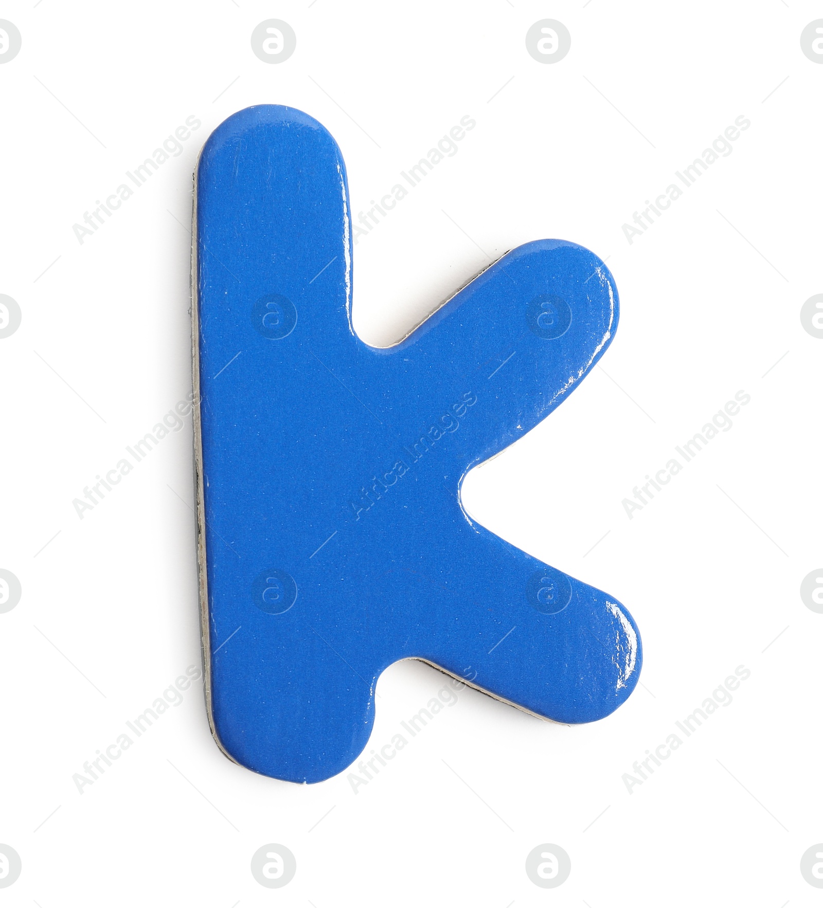 Photo of Blue magnetic letter K isolated on white, top view. Alphabet