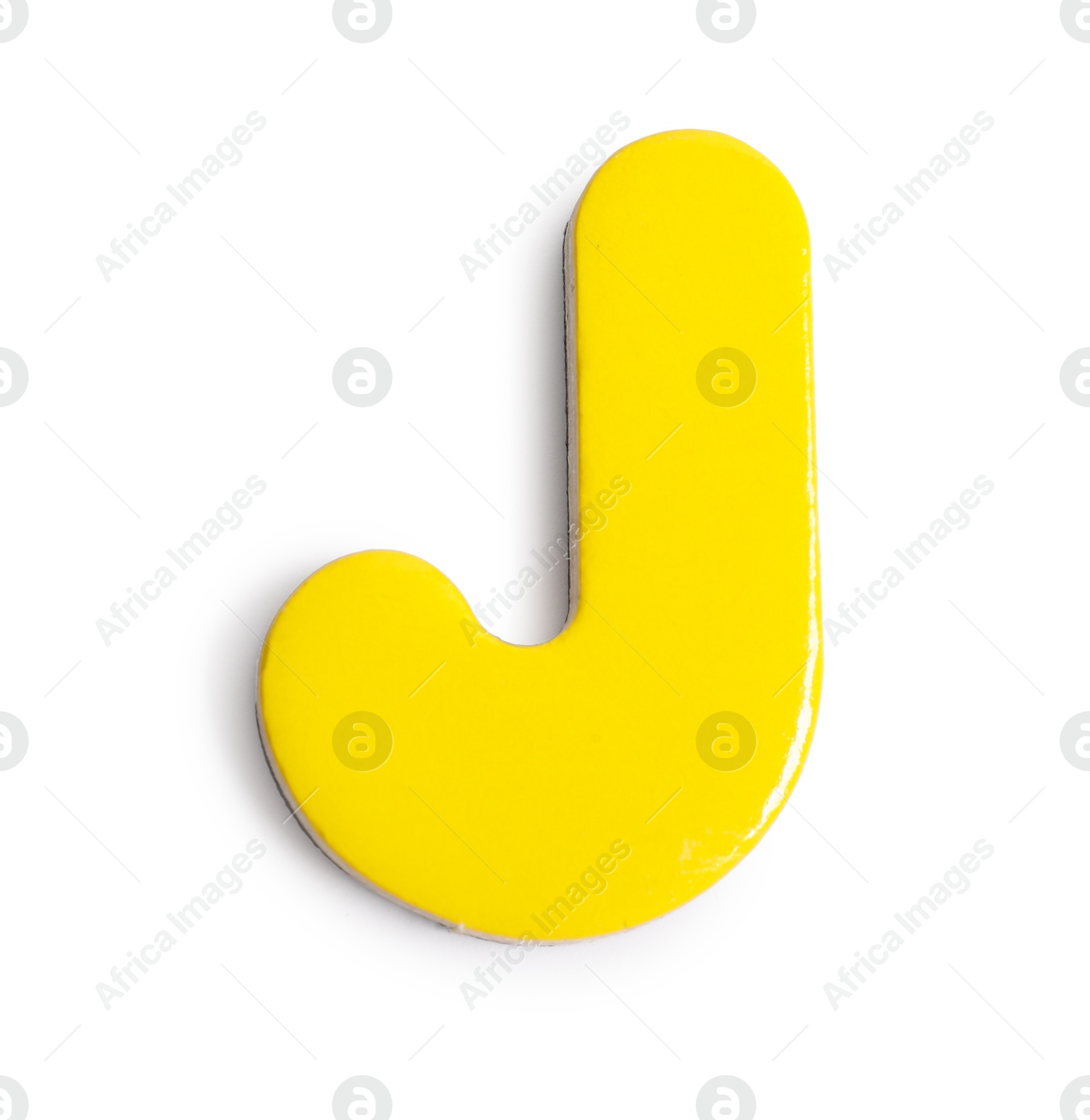 Photo of Yellow magnetic letter J isolated on white, top view. Alphabet