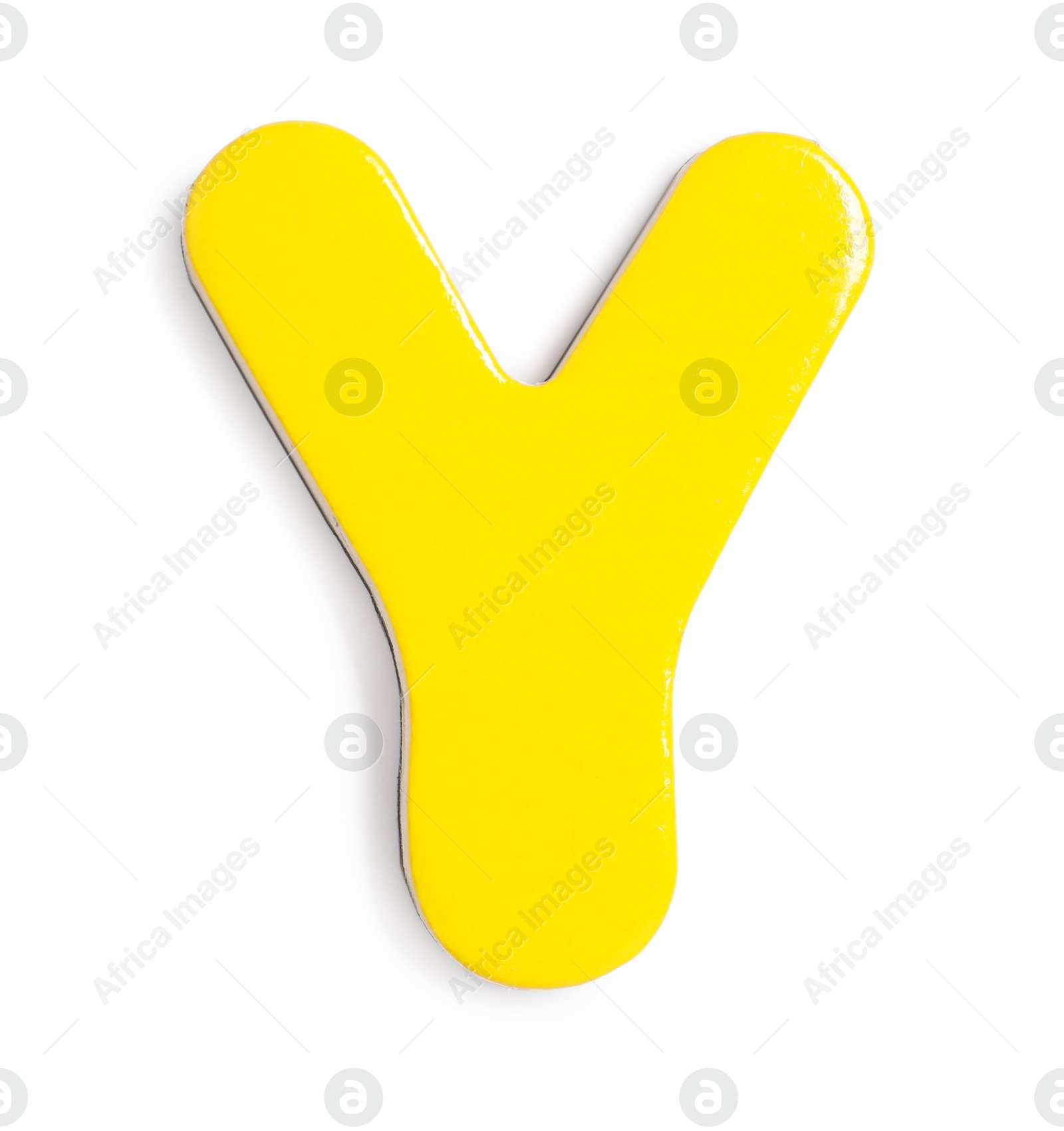 Photo of Yellow magnetic letter Y isolated on white, top view. Alphabet