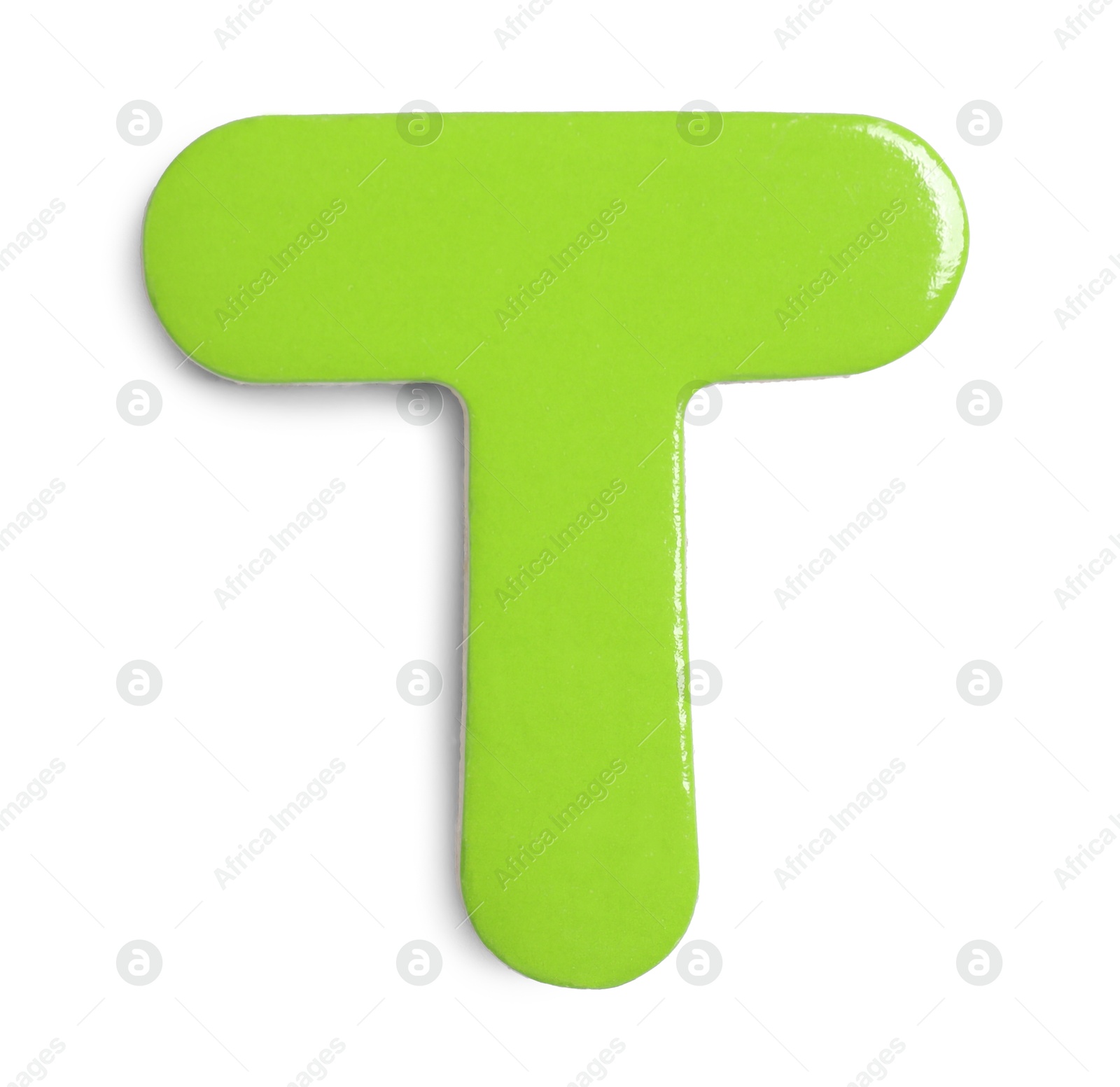 Photo of Green magnetic letter T isolated on white, top view. Alphabet