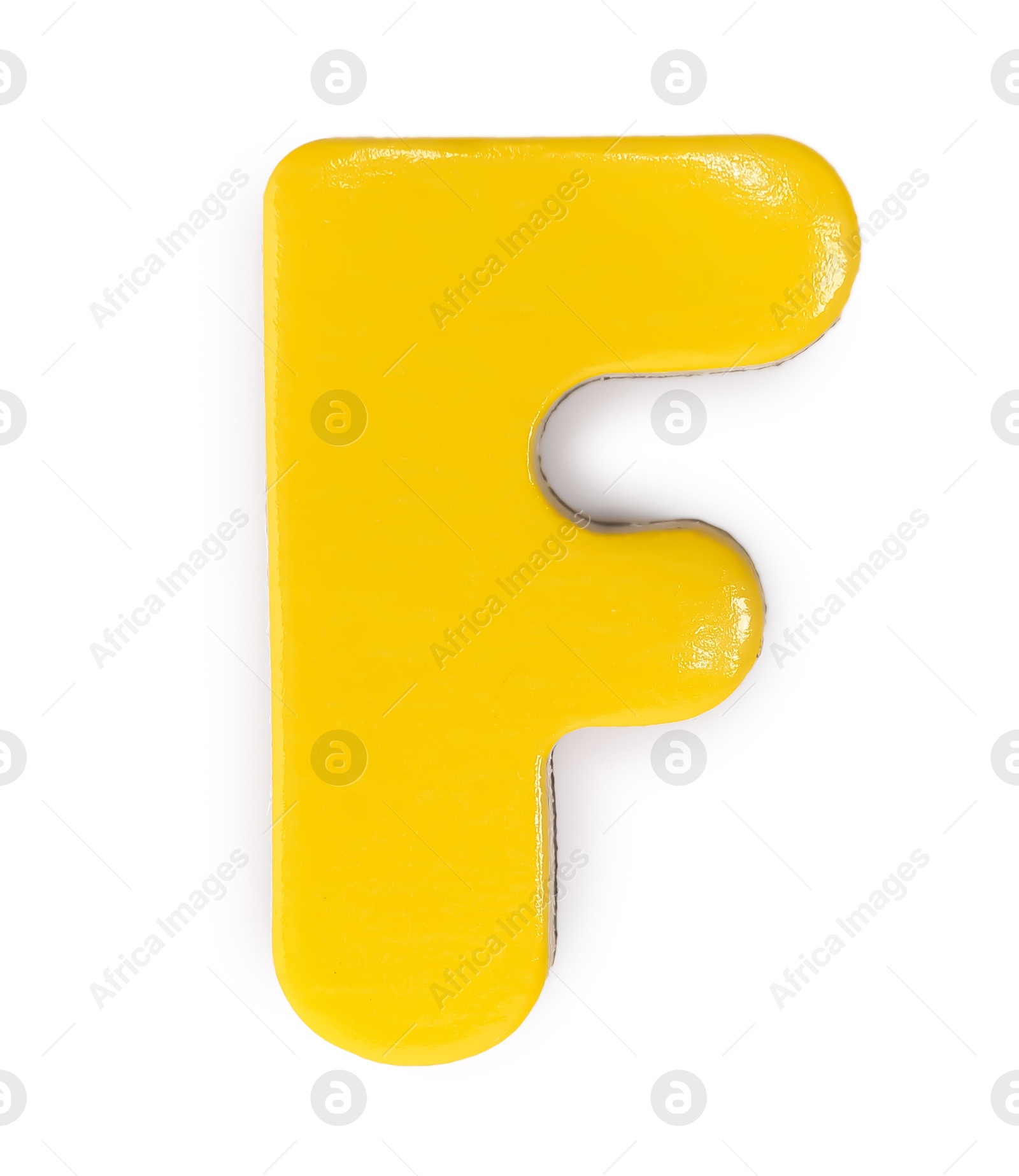 Photo of Yellow magnetic letter F isolated on white, top view. Alphabet