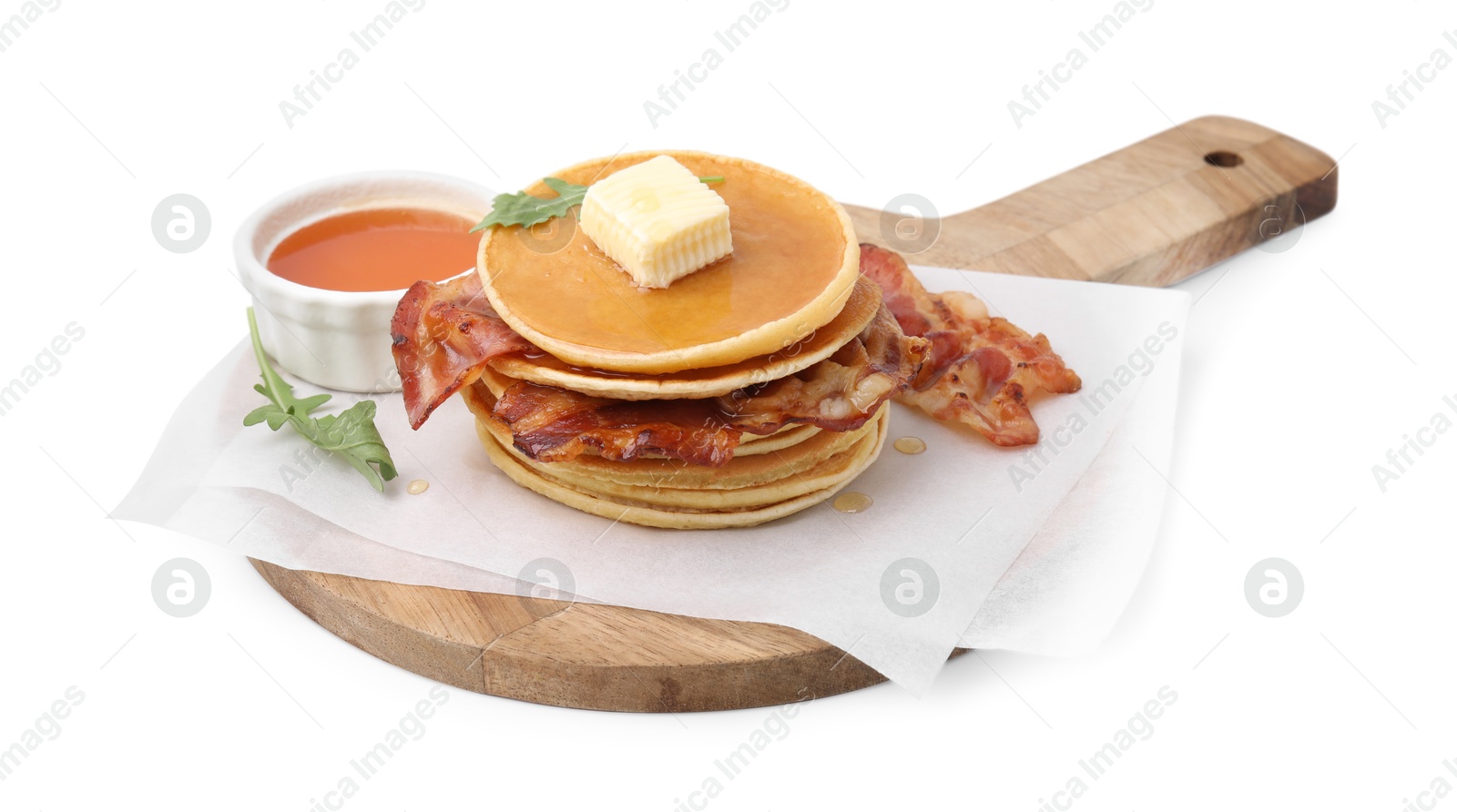 Photo of Delicious pancakes with bacon, butter, arugula and honey isolated on white