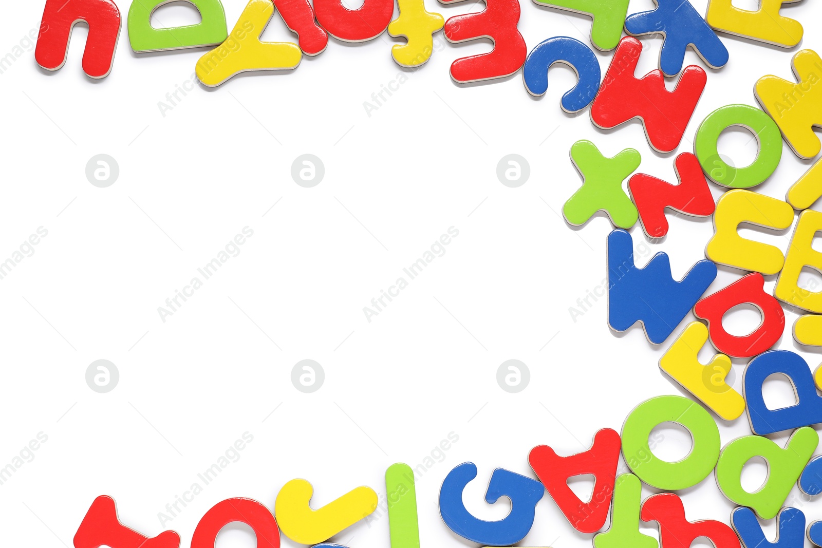 Photo of Alphabet. Many colorful magnetic letters isolated on white, top view