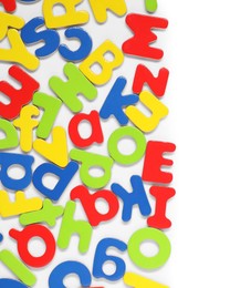 Alphabet. Many colorful magnetic letters isolated on white, top view