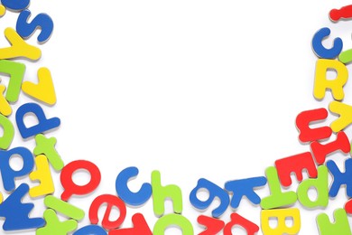 Alphabet. Many colorful magnetic letters isolated on white, top view