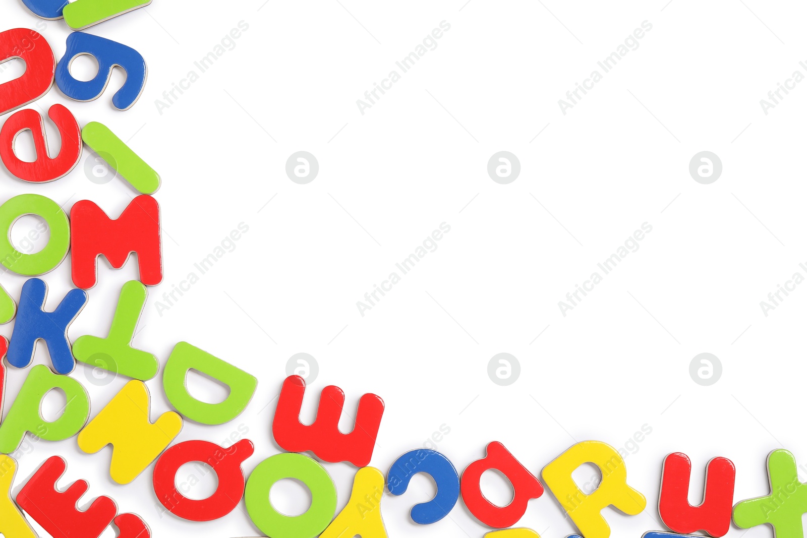 Photo of Alphabet. Many colorful magnetic letters isolated on white, top view