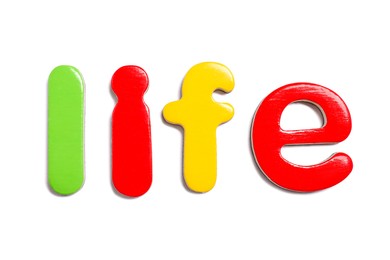 Photo of Alphabet. Word Life of magnetic letters isolated on white, top view