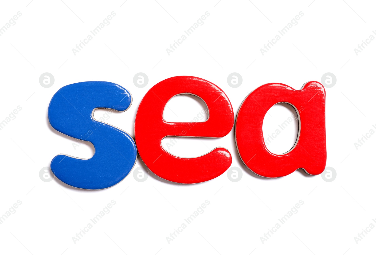 Photo of Alphabet. Word Sea of magnetic letters isolated on white, top view