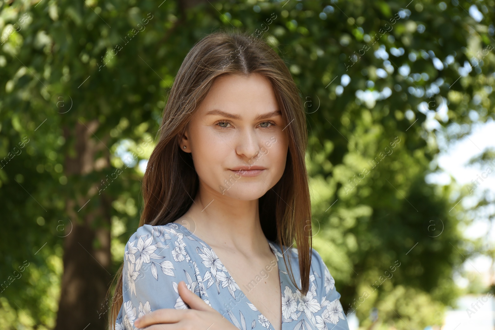 Photo of Portrait of beautiful woman in summer park