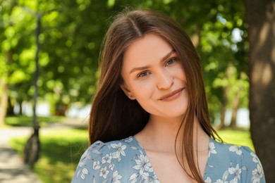 Photo of Portrait of beautiful woman in summer park