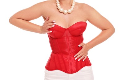 Woman in red corset on white background, closeup