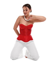 Photo of Beautiful woman in red corset posing on white background