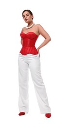 Beautiful woman in red corset posing on white background, low angle view