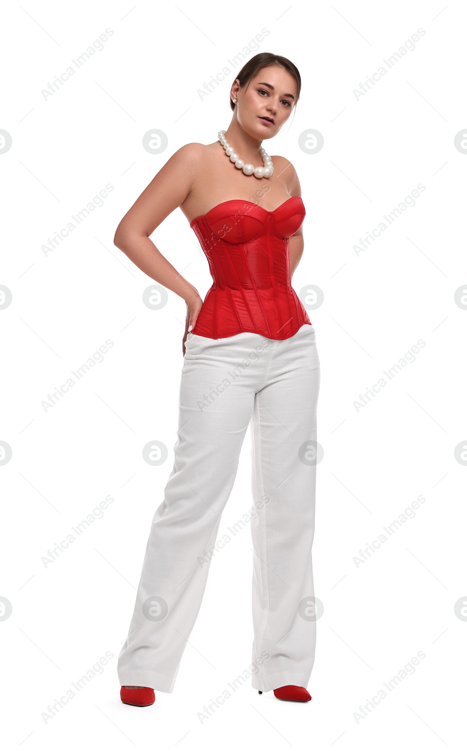 Photo of Beautiful woman in red corset posing on white background
