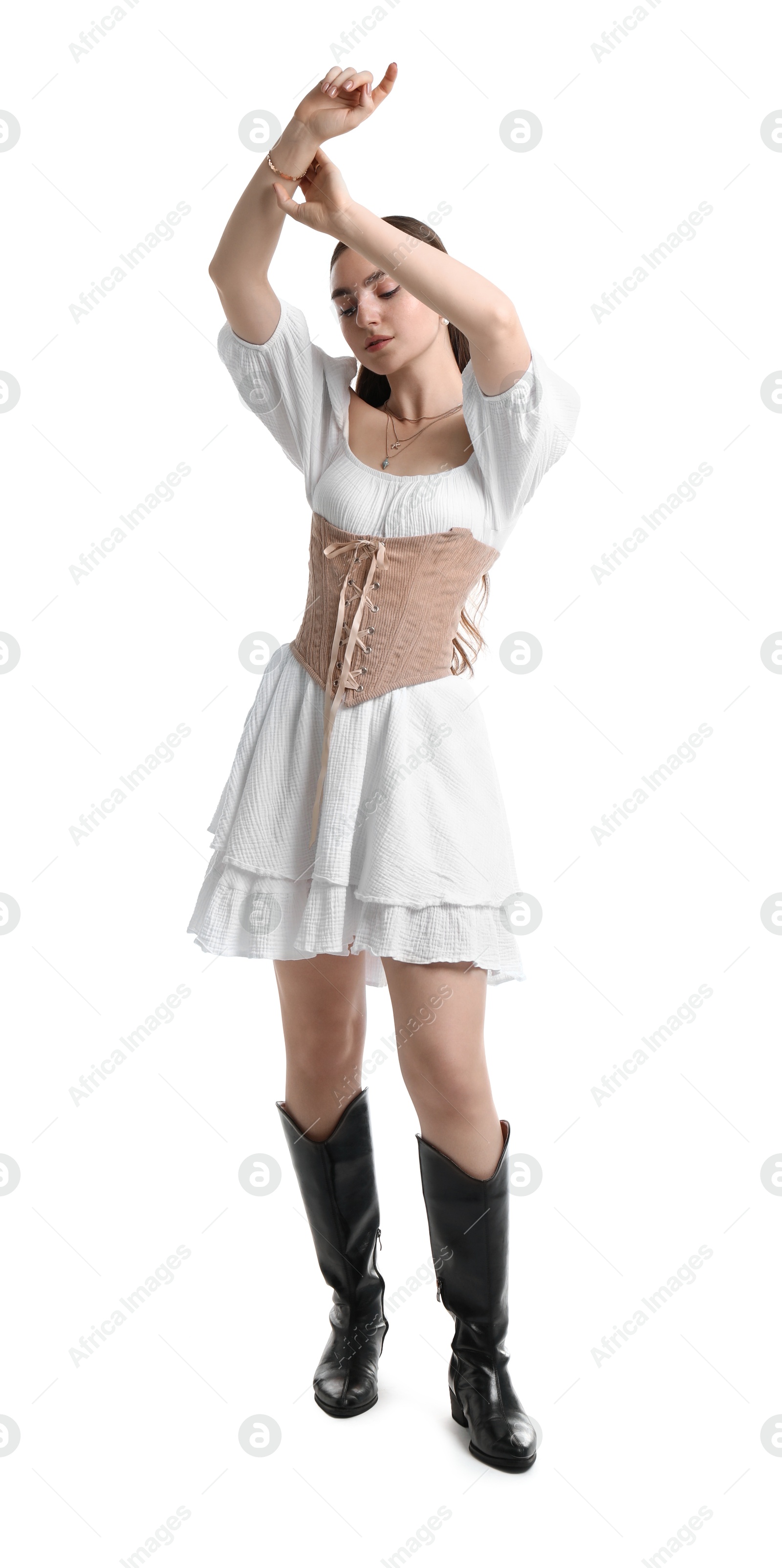 Photo of Beautiful woman in velvet corset posing on white background