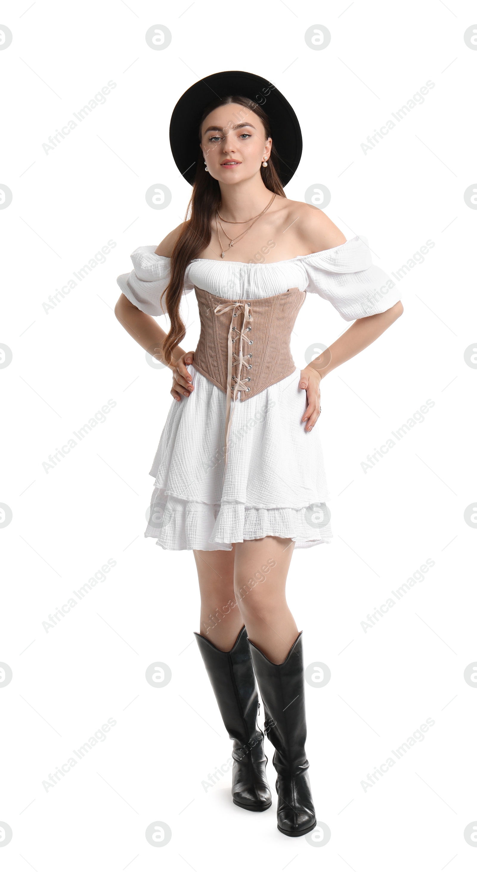 Photo of Beautiful woman in velvet corset and hat posing on white background