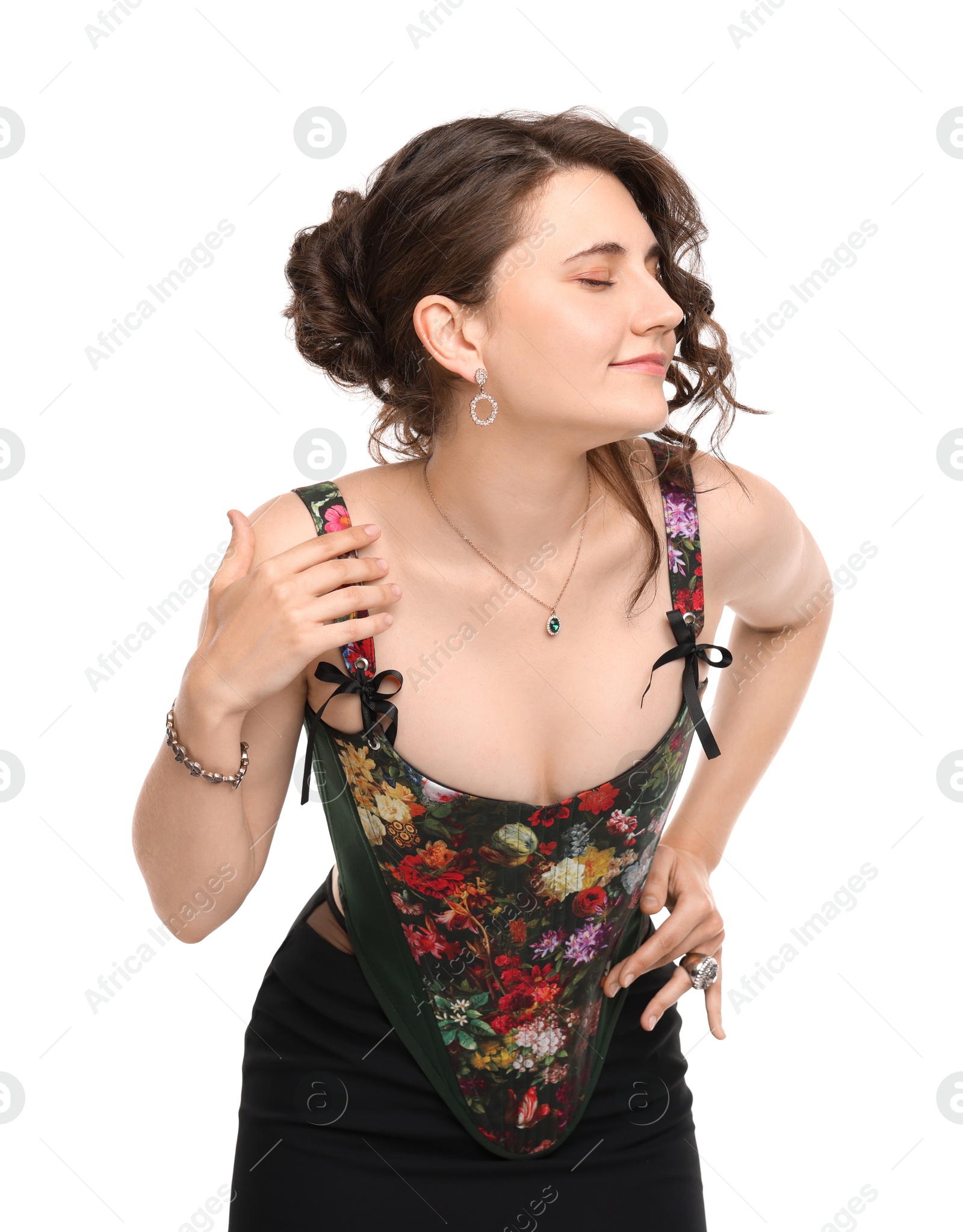 Photo of Beautiful woman in stylish corset posing on white background
