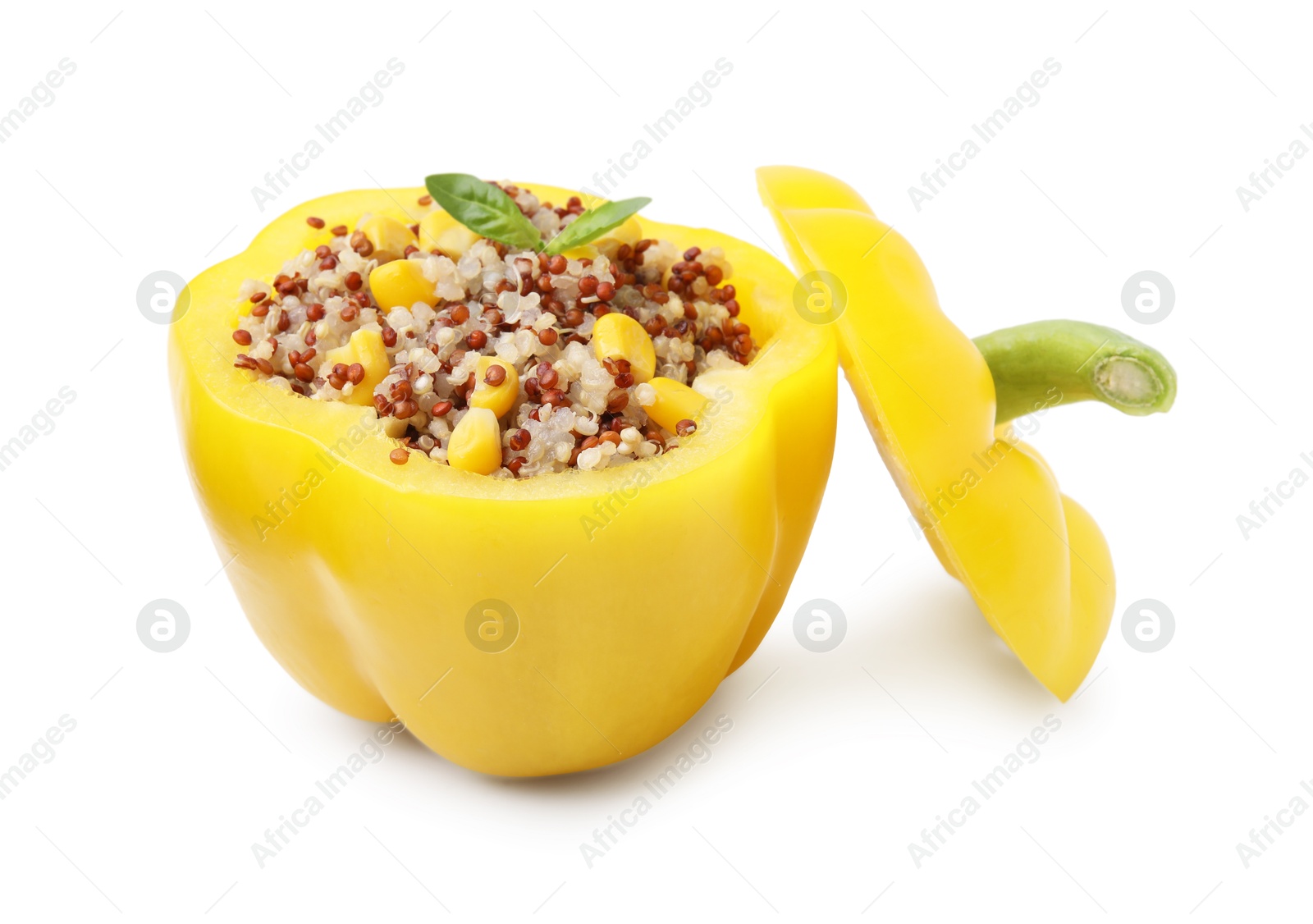 Photo of Quinoa stuffed bell pepper and basil isolated on white