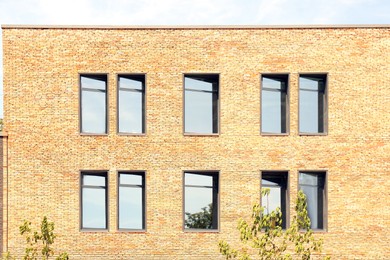 Photo of Exterior of brick building with glass windows